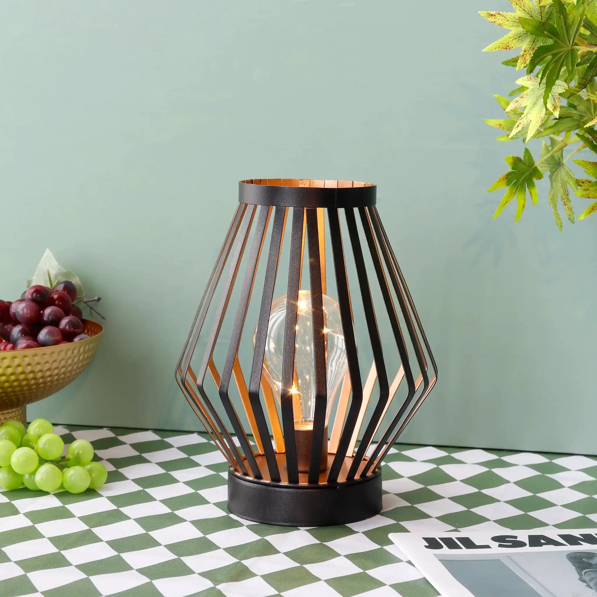8.7-inch tall battery-powered table lamp Diamond; black metal wireframe with warm glow.