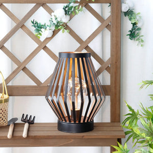 JHY DESIGN 8.7-inch tall battery-powered diamond table lamp; black metal slat frame with copper interior and warm glow.
