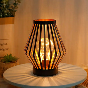 JHY DESIGN 8.7H tall battery-powered table lamp with a black slatted diamond shade and warm glow.