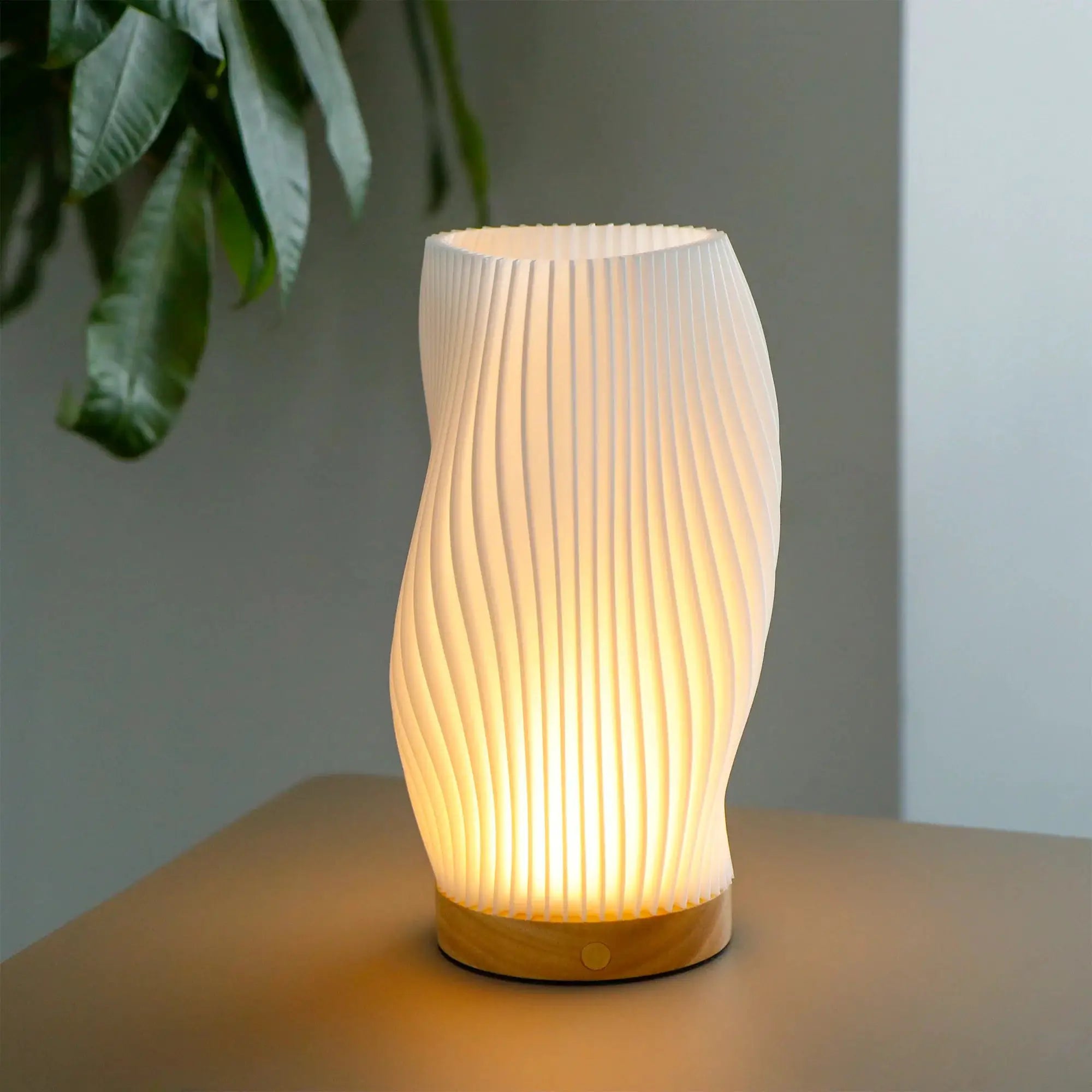 9in touch table lamp with white pleated spiral shade on a wooden base, battery operated.