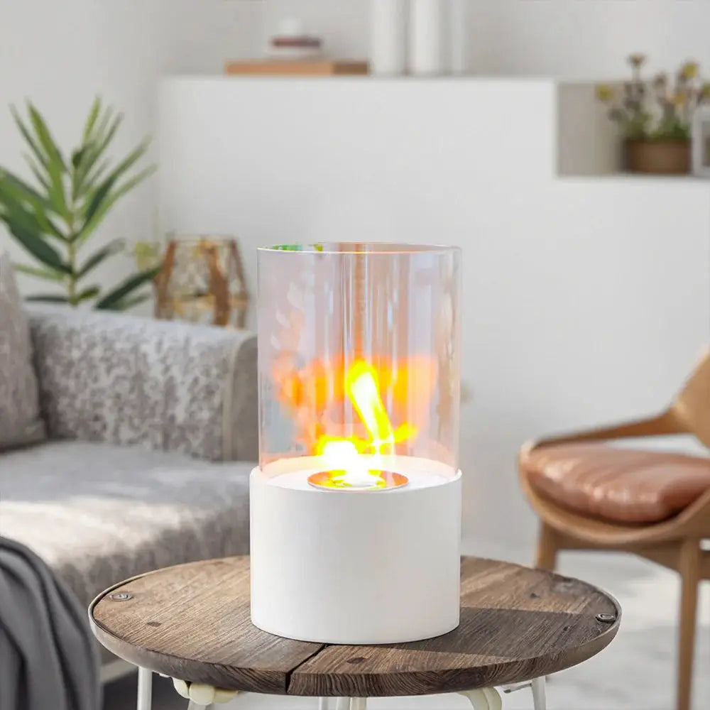 11.4"H round white tabletop fireplace with a glass cylinder by JHY DESIGN, showcasing a warm flame.