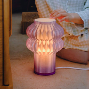 Oppi Table Lamp by Terra Labs; purple ribbed glass with warm amber glow