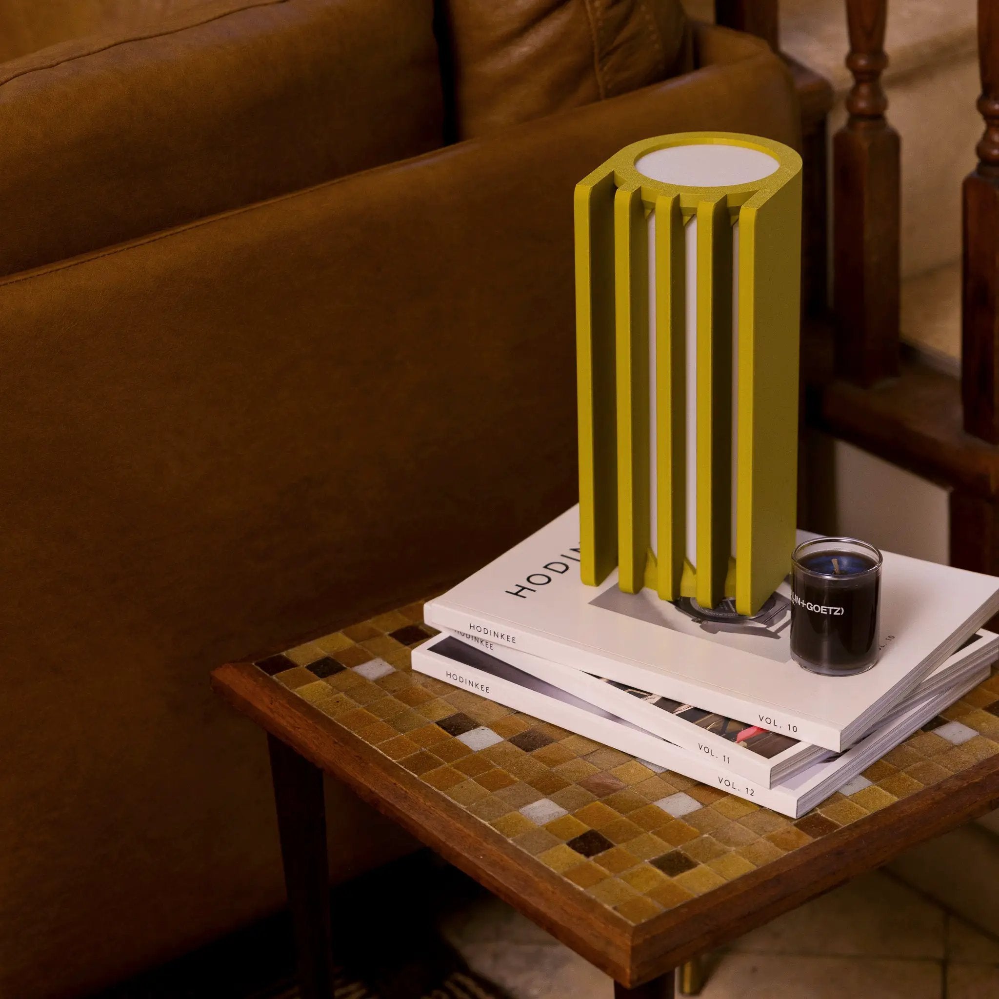 Radiator Table Lamp by Terra Labs, lime-yellow vertical-slat design on a white coffee table.