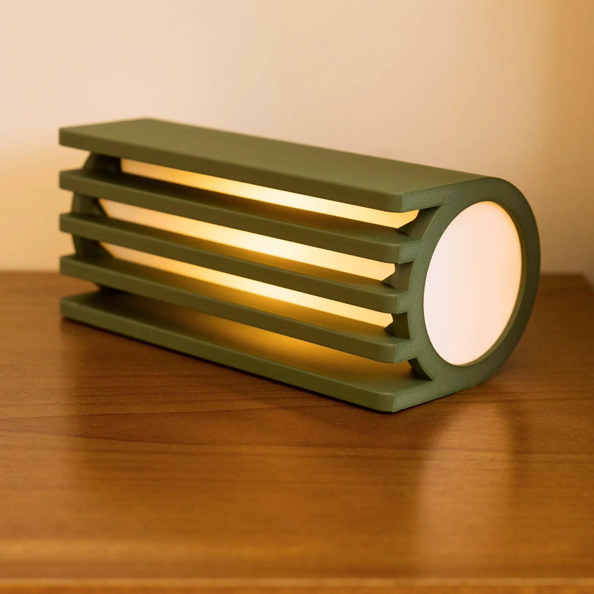 Terra Labs Radiator Table Lamp with a green slatted metal frame and white circular shade.