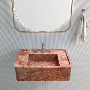 Rectangular wall-mount bathroom sink in red travertine with brass faucet, 30in long x 16in wide