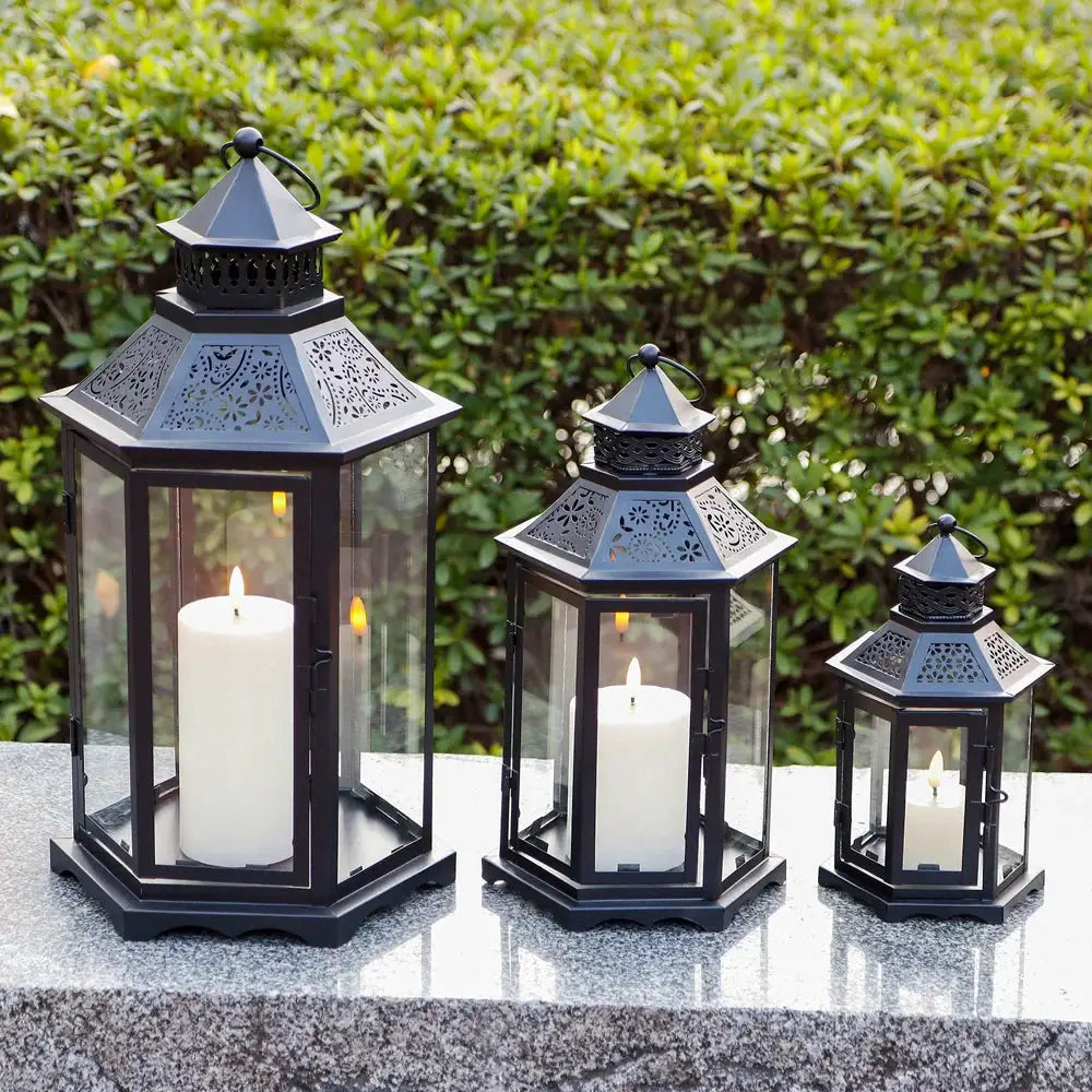 Set of 3 black hexagonal candle lanterns in 18, 13, and 10 in with glass panels and vintage perforated roofs by JHY DESIGN
