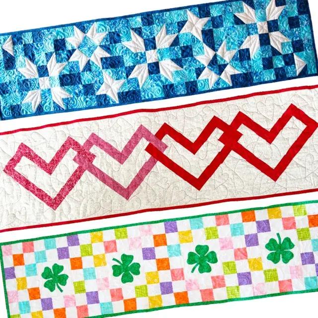 Seasonal Quilted Table Runner Kit Bundle, Winter/Spring; three-panel design with blue star blocks and pink zigzag.