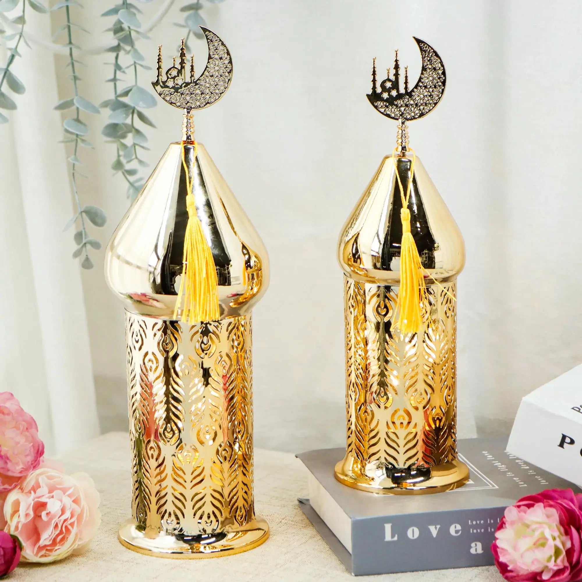 Set of 2 gold electric Ramadan lanterns with crescent-moon tops and ornate filigree bodies.