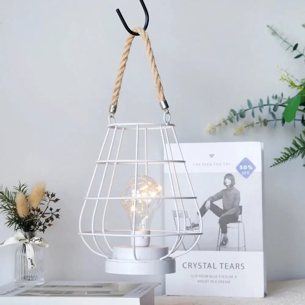 8.5-inch tall cordless accent light by JHY DESIGN with white wire cage and Edison-style bulb.