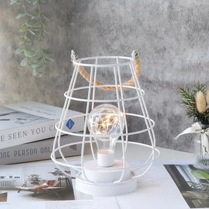 8.5in cordless accent lamp with Edison-style bulb in white metal cage