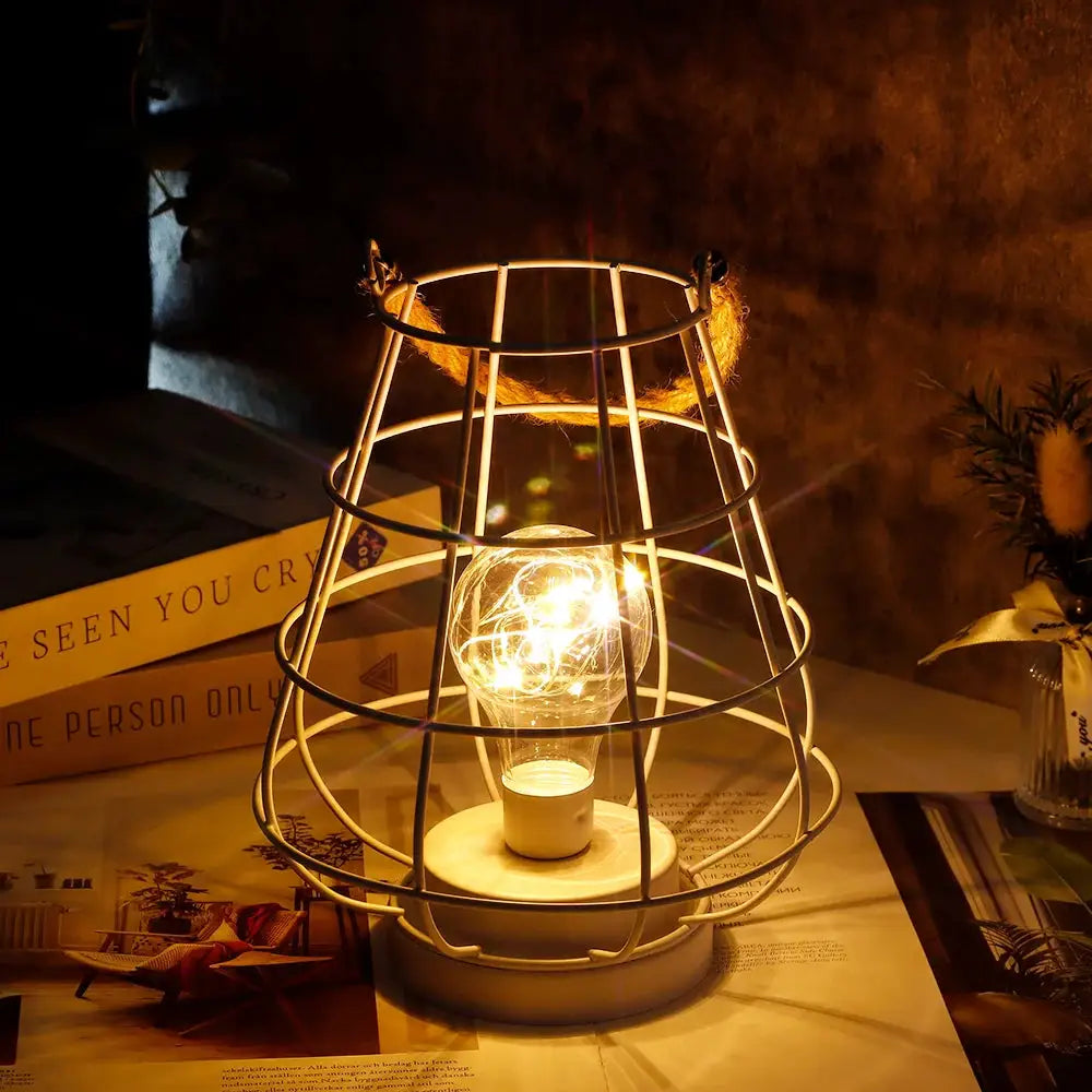 JHY DESIGN cordless accent lamp, 8.5 inches tall, Edison-style bulb in white metal wire cage.