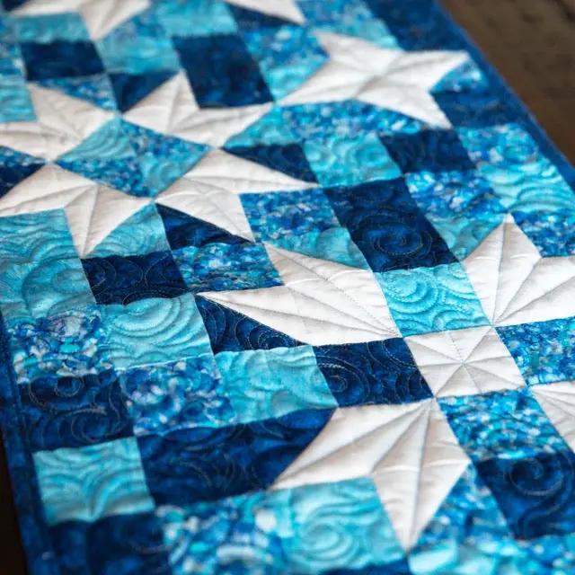 Standout Stars Table Runner Pattern in blue star blocks; finished 14x54.