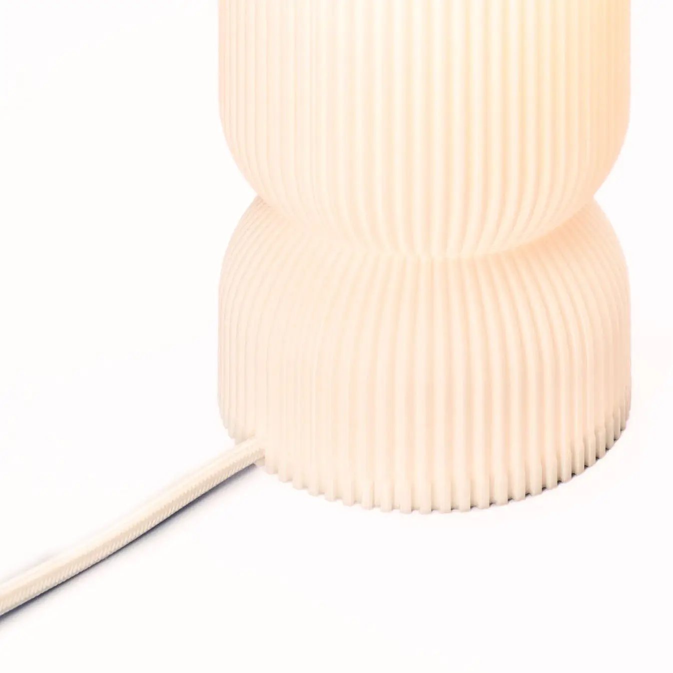 Stance Table Lamp by Terra Labs; peach ribbed pleated base with fabric cord