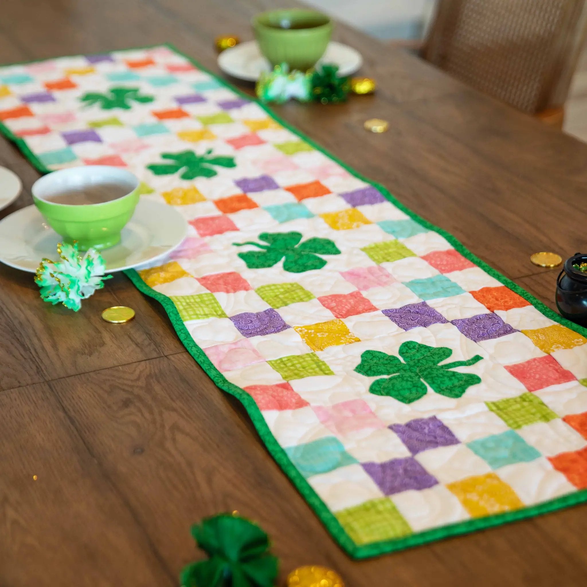 Shamrocks Rainbow Table Runner Precut Quilt Kit by Block Party Quilt Co; multicolor squares with green border