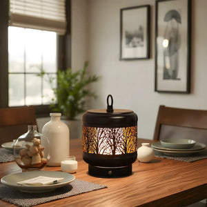 Desk lamp with black cylindrical base and tree-pattern shade, warm glow from 4000mAh rechargeable battery.