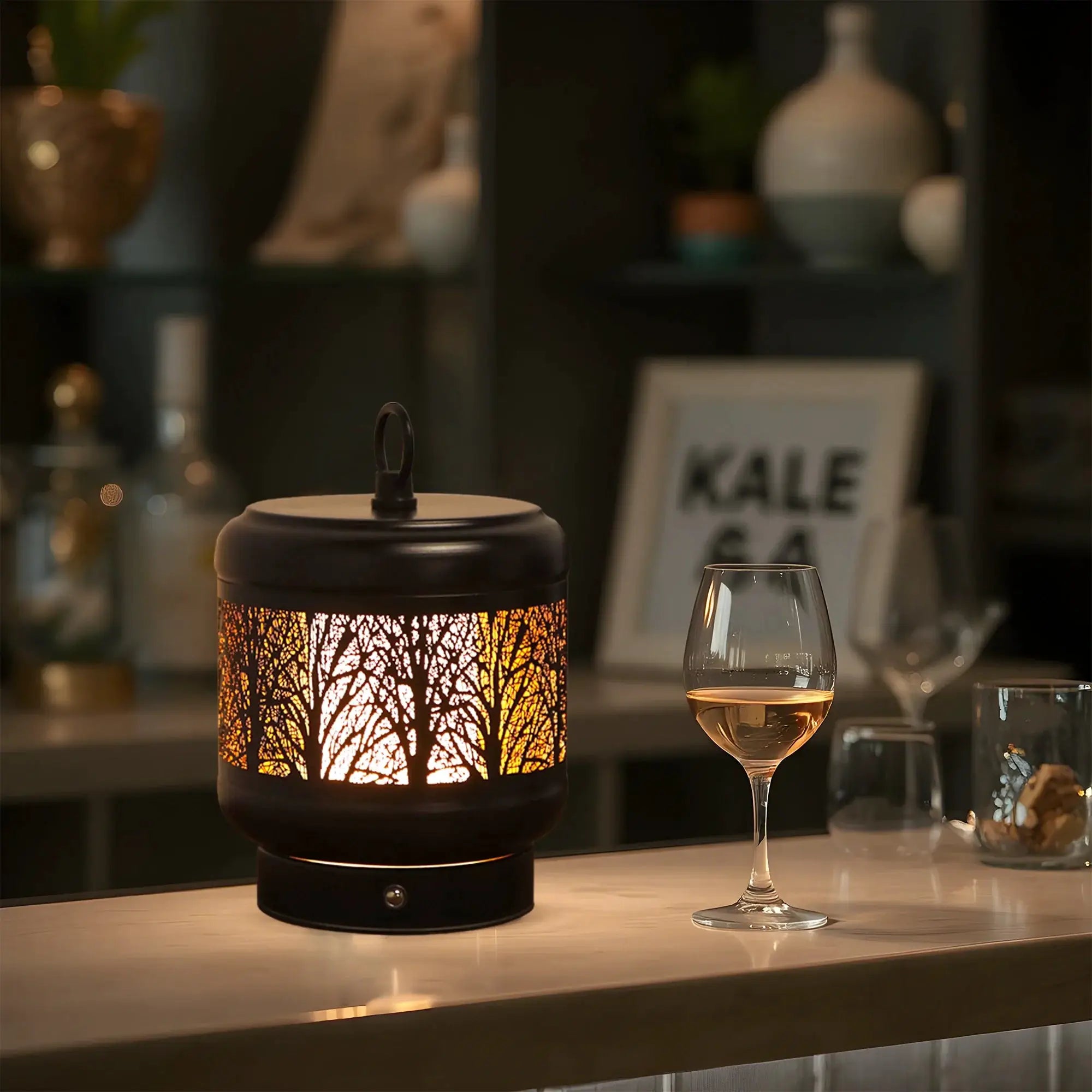 JHY DESIGN 4000mAh rechargeable desk lamp on table, black metal with warm amber glow.