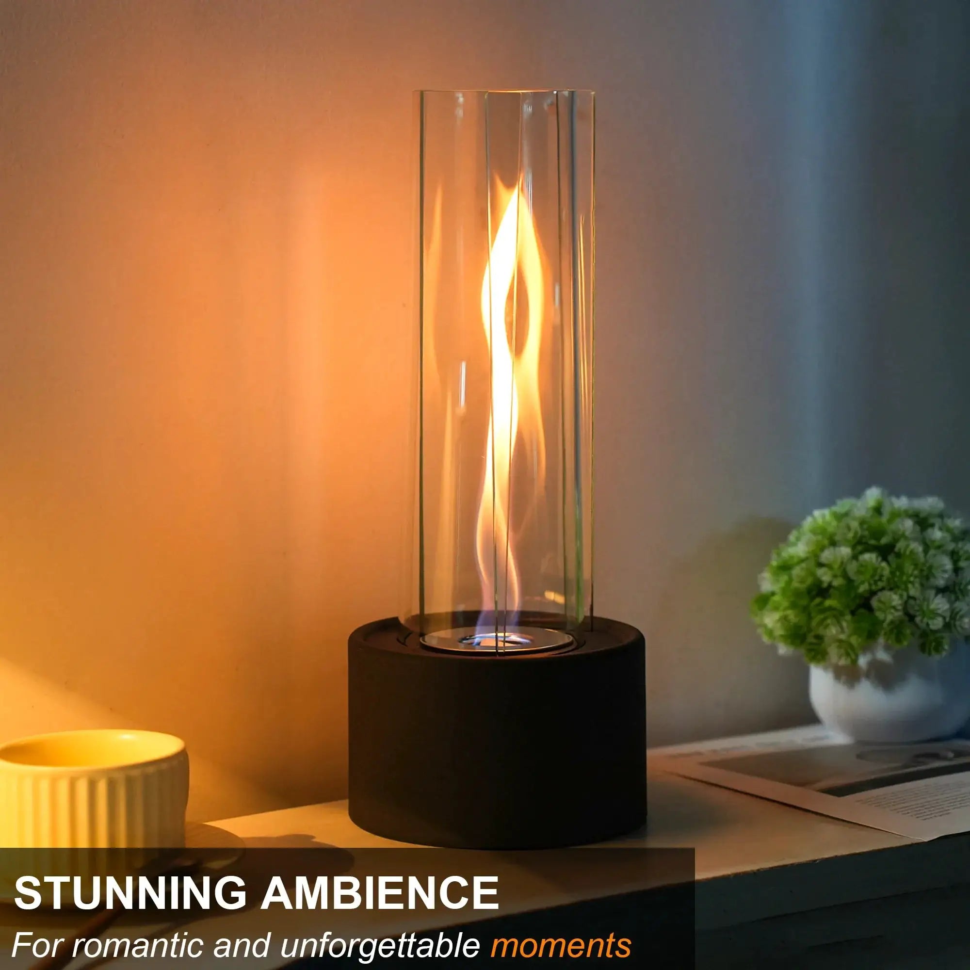 Cylindrical Bioethanol Vented-Free Fireplace by JHY DESIGN; glass cylinder with flame on a black base, 16 × 16 × 39 cm.