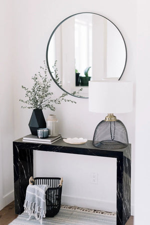 Toros Black Marble Rectangular Console by Villohome; polished black marble with white veining and a round wall mirror.