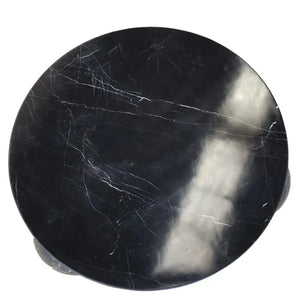 Toros black marble round designer coffee table with sphere legs.