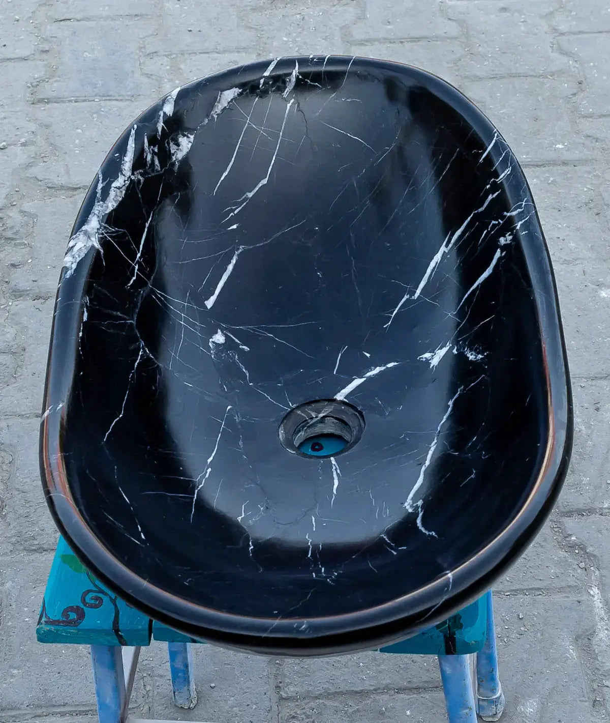 Toros black marble above-vanity bathroom sink by Villohome; oval stone sink with white veining