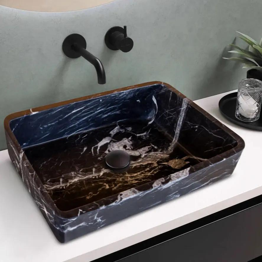 Toros black marble rectangular above-counter bathroom sink with brown edges and matte-black wall faucet