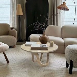 Troia Light Travertine vein-cut round coffee table by Villohome, polished travertine with sculptural pedestal base.
