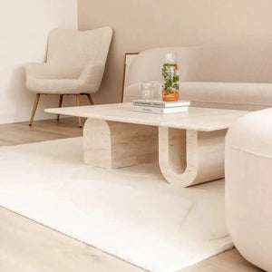 Troia Light Travertine Designer Coffee Table with U-shaped legs, 28W x 48L x 13H inches, light travertine finish.