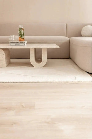 Troia Light Travertine coffee table by Villohome with U-shaped legs, 28x48x13 in, light beige travertine.