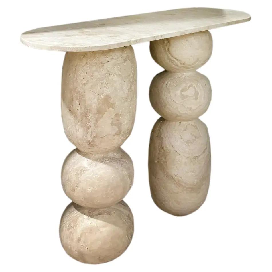 Troia Light Travertine Designer Console by Villohome; filled and honed travertine with rounded sculpted leg columns.