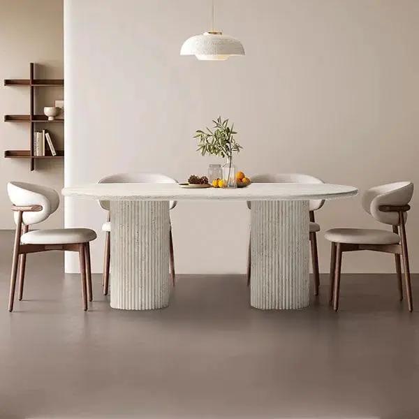 Troia Light Travertine Oval Dining Table with Fluted Round Legs in natural stone finish
