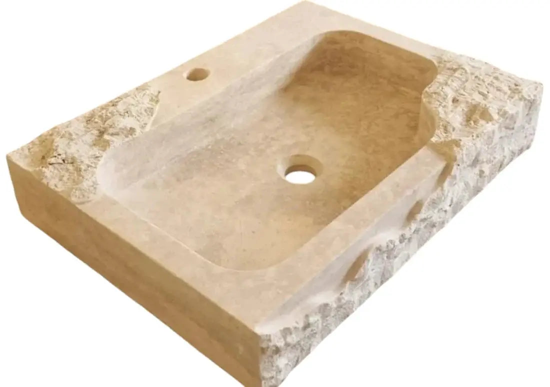 Beige travertine rectangular wall-mount bathroom sink with rustic edges, faucet hole, and central drain