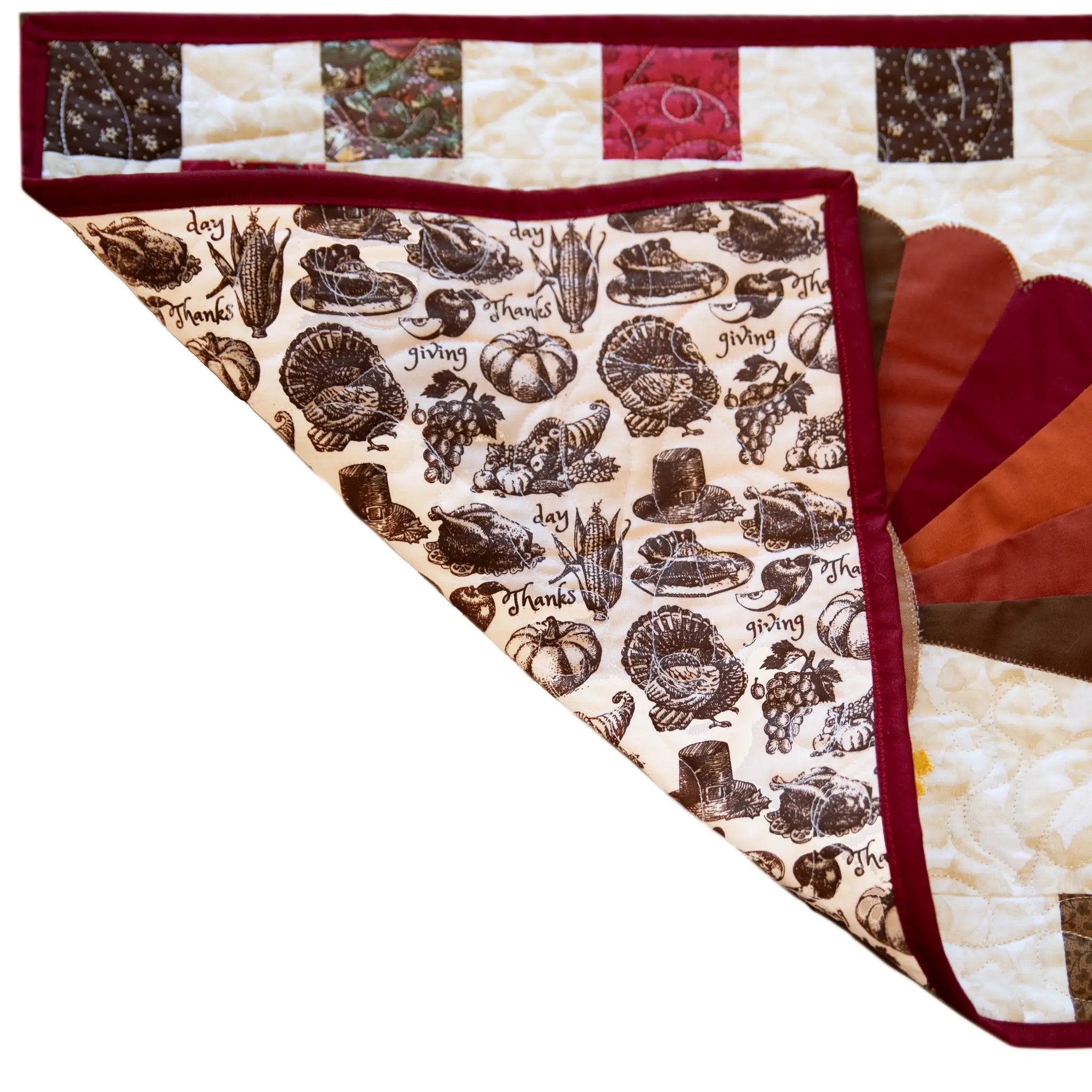 Quilt kit for Turkey Thanksgiving table runner; burgundy binding and turkey-print backing.