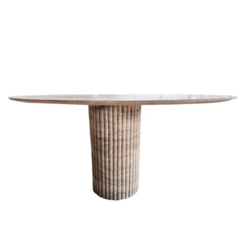 Oval beige travertine coffee table by Villohome with a fluted cylindrical pedestal base and rounded edges