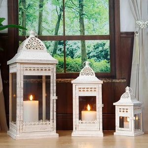 Decorative candle lanterns set, beige vintage metal with glass panels, three sizes: 20in, 14.5in, 9.5in.