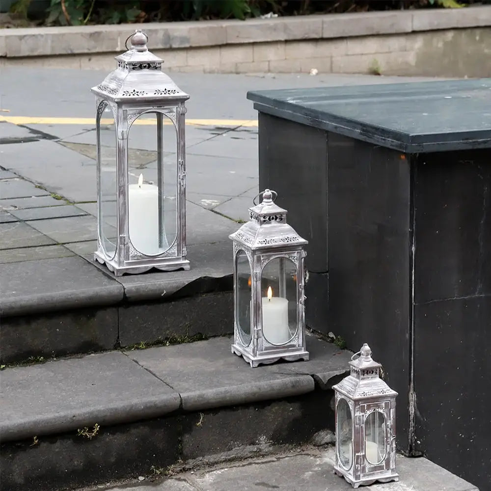 Decorative candle lanterns set, cement-gray metal with vintage design by JHY DESIGN; includes 10, 14, and 19.5 in heights.