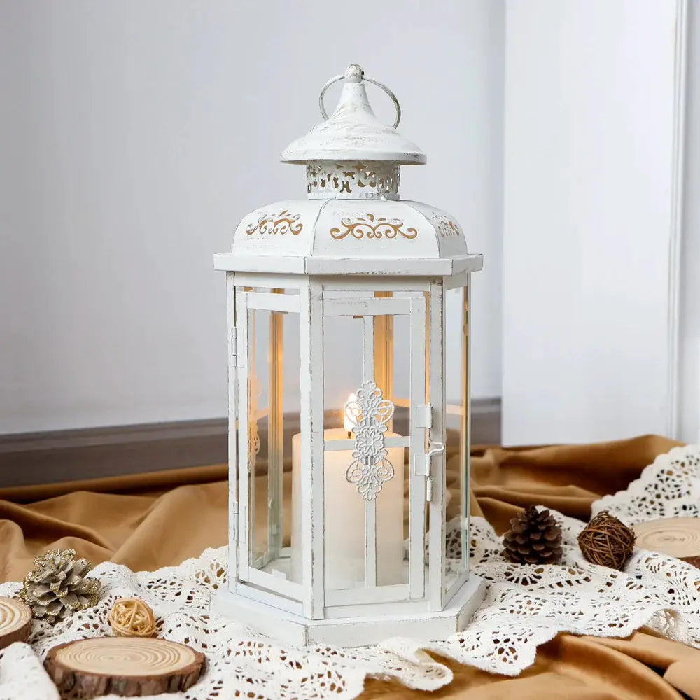 12-inch tall candle lantern, white with gold brush finish, vintage metal decorative lantern with lit candle.