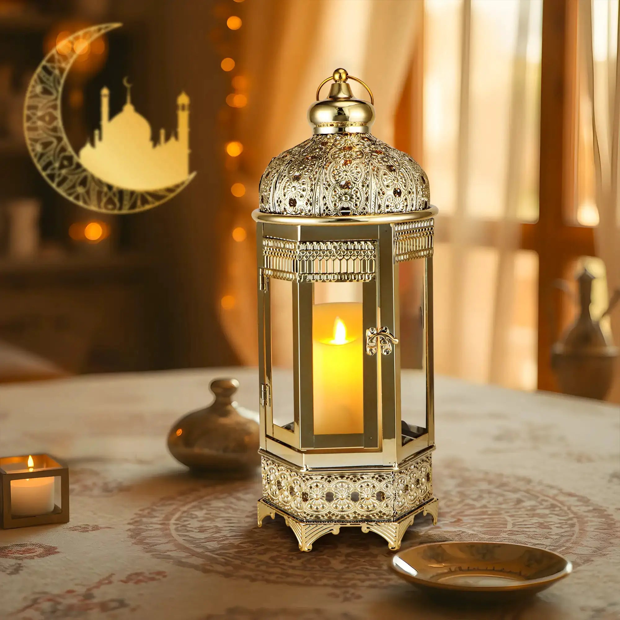 Moroccan Candle Lantern, 16-inch gold hexagonal metal with intricate filigree and lit candle inside