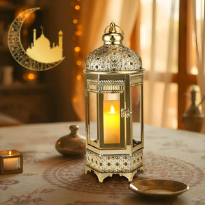 Moroccan Candle Lantern, 16-inch gold hexagonal metal with intricate filigree and lit candle inside
