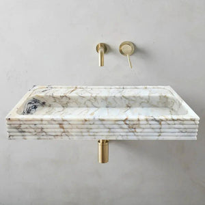 Villohome Calacatta Viola gold marble wall-mount bathroom sink with horizontal fluted sides and two brass fixtures