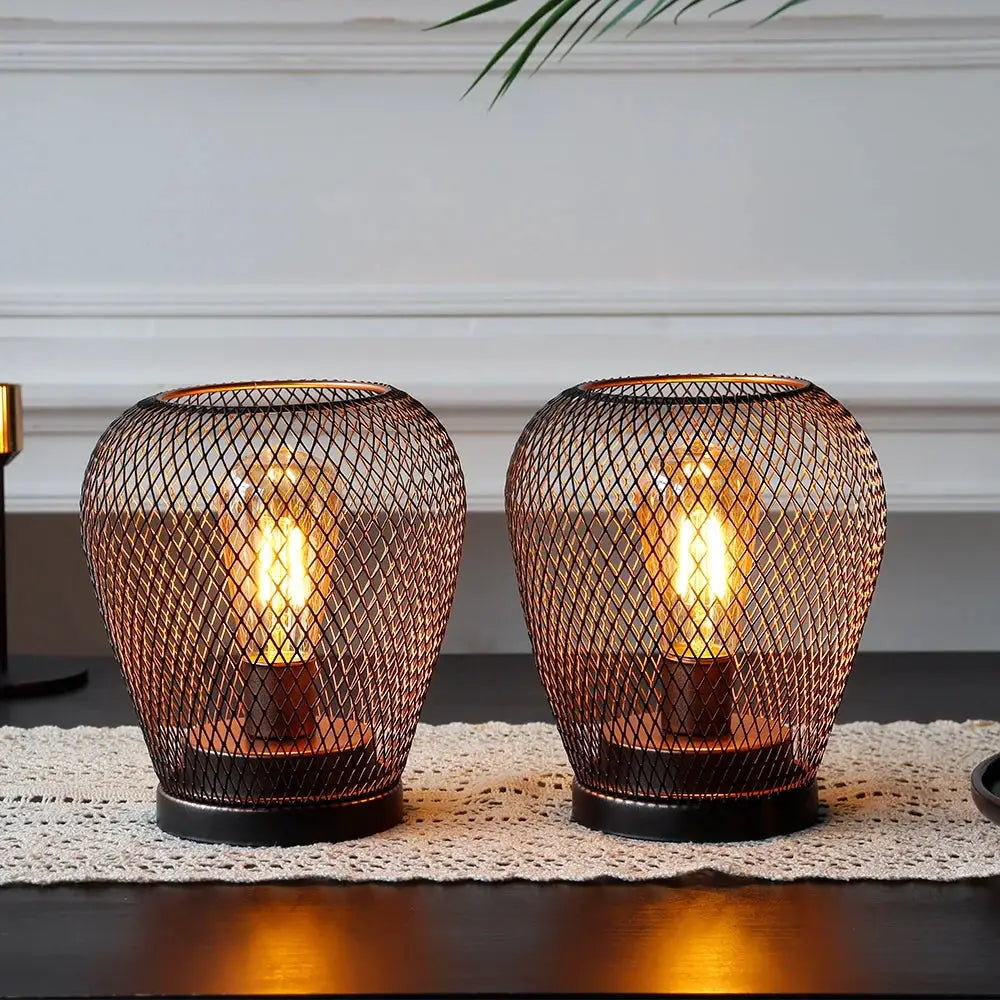 Battery-powered outdoor table lamps set of 2 by JHY DESIGN, 6.7-inch tall, with bronze wire-mesh cages and warm bulbs.