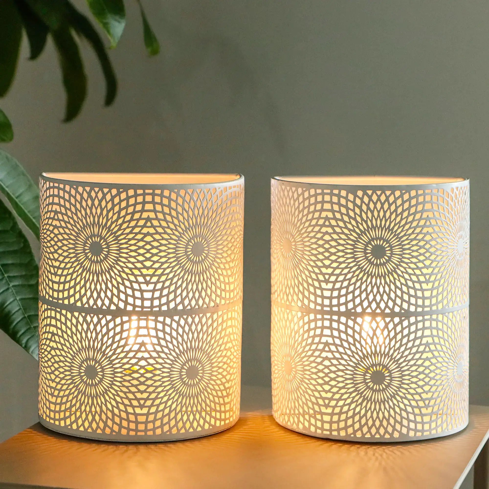 Set of 2 8in Sunflow white wall sconces; battery-powered lamps with perforated geometric shades by JHY DESIGN