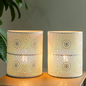 Set of 2 8in Sunflow white wall sconces; battery-powered lamps with perforated geometric shades by JHY DESIGN