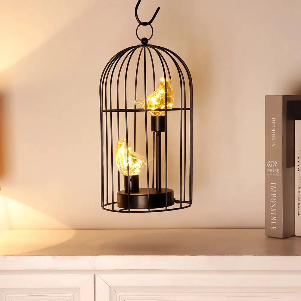 12-inch tall JHY DESIGN battery-operated birdcage lamp with two warm LED bird lights inside a black metal cage