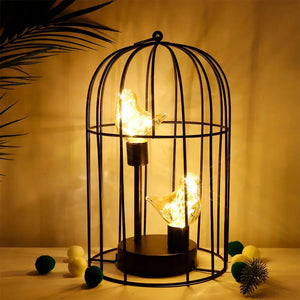 12-inch tall battery-operated birdcage lamp in black metal with two warm bird-shaped lights