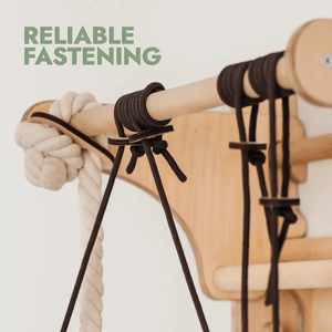 Wooden Swedish wall climbing ladder by Goodevas with dark brown ropes and knots