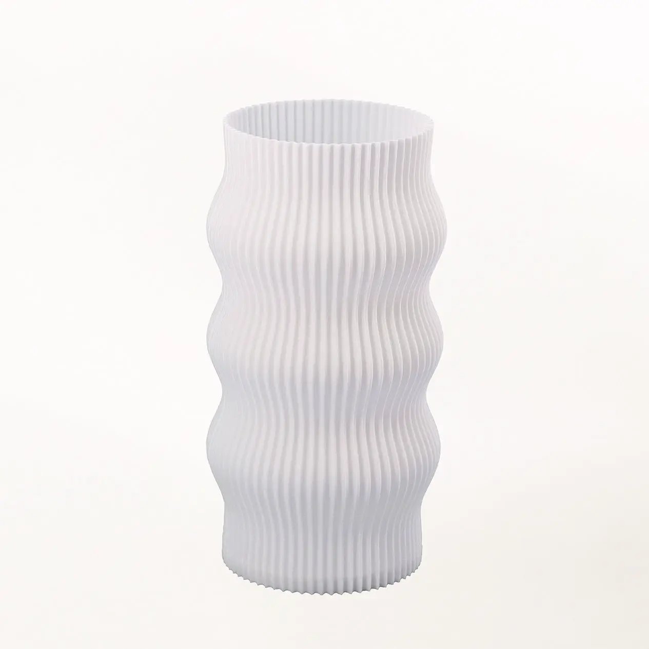 Wub Table Lamp by Terra Labs, white ribbed lamp with vertical wavy ridges.