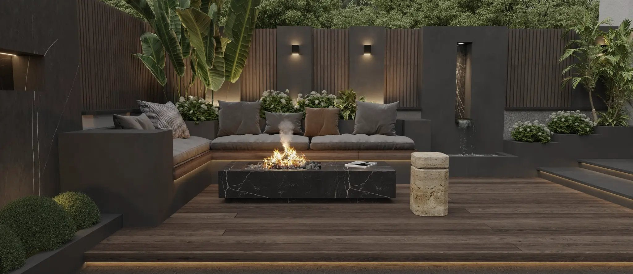 Freestanding black marble fire pit table with glowing flames in a modern outdoor lounge with neutral cushions.